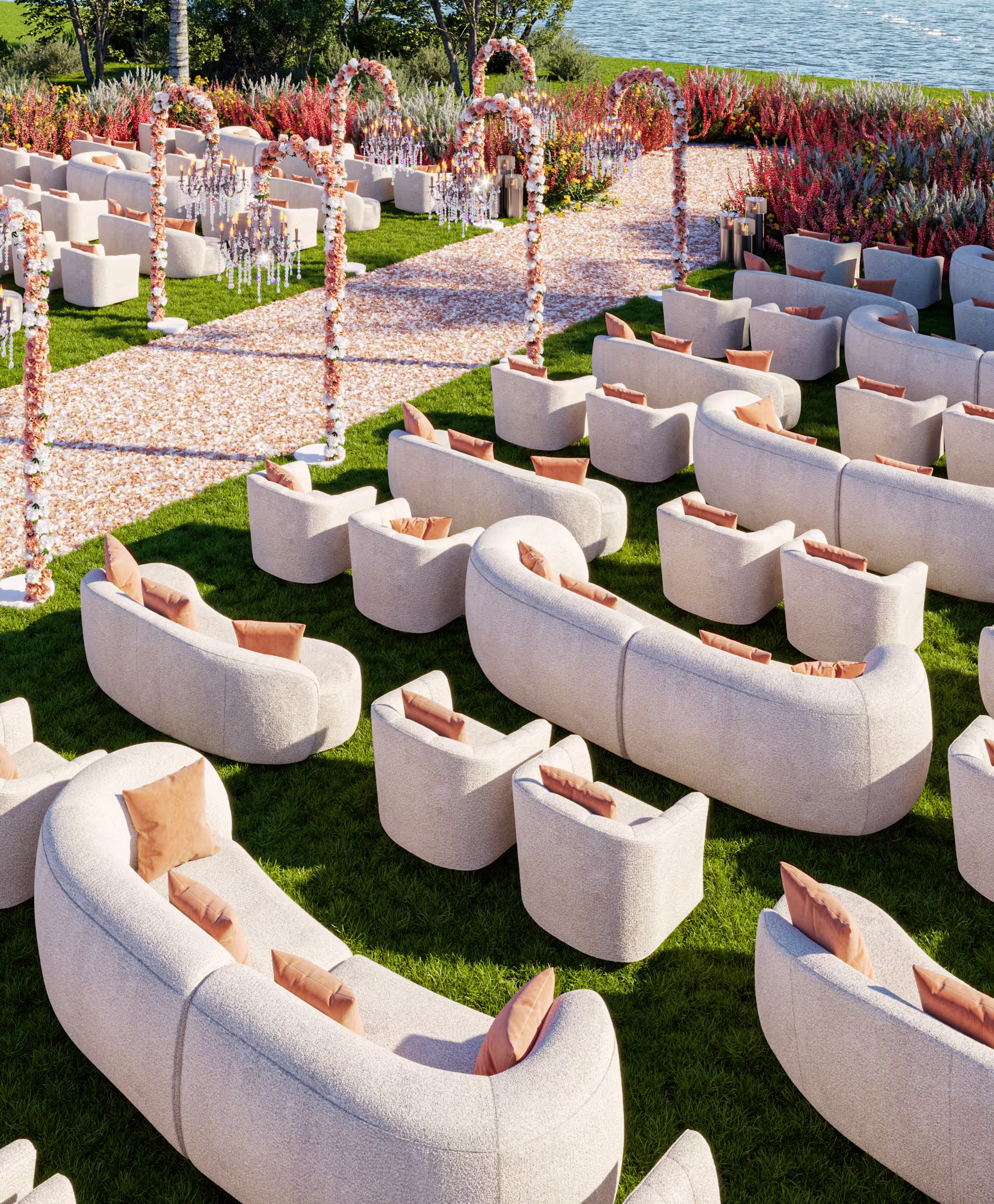 Outdoor lounge seating arrangement with curved sofas and soft cushions for a stylish garden event